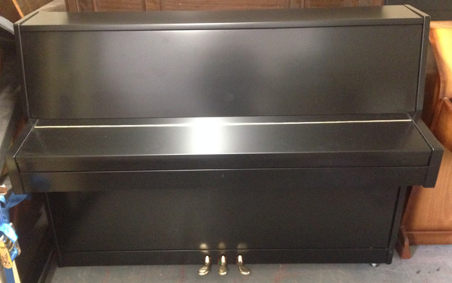 Black satin piano.