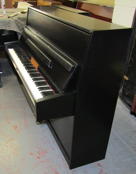 Sideview of Osztreicher upright piano.