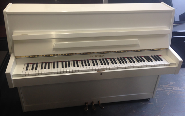 Waldstein modern white gloss piano.