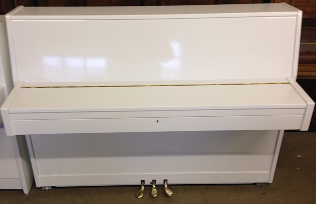 Waldstein white gloss upright piano. 