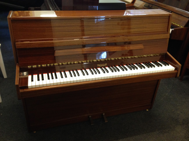 eavestaff small mahogany piano.