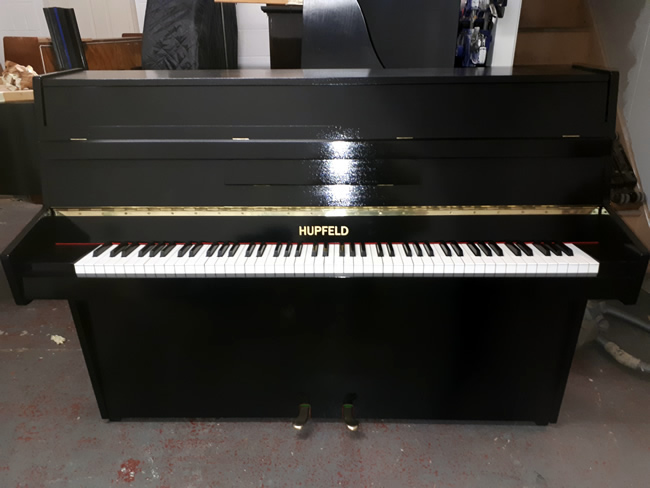 hupfeld modern piano repolished in a Black gloss finish.