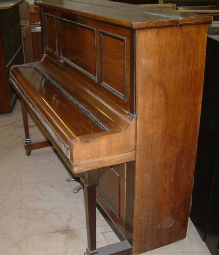 Rogers upright piano in a Rosewood Cabinet