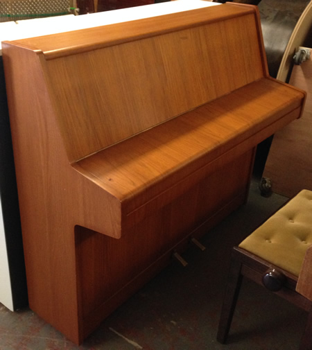 Sideview of Kemble piano.