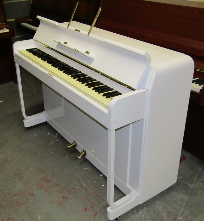 White gloss Kemble piano.