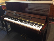 Richter mahogany gloss upright piano.