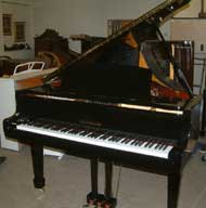 Kauffmann baby grand piano in a High Gloss finish.