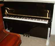 New Stultz & Bauer upright piano in a traditional style cabinet