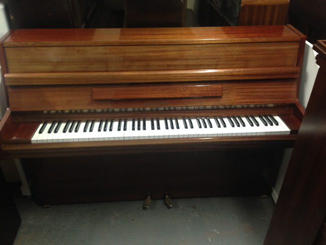 Reid Sohn modern upright before being repolished Black with a Satin or Gloss finish.