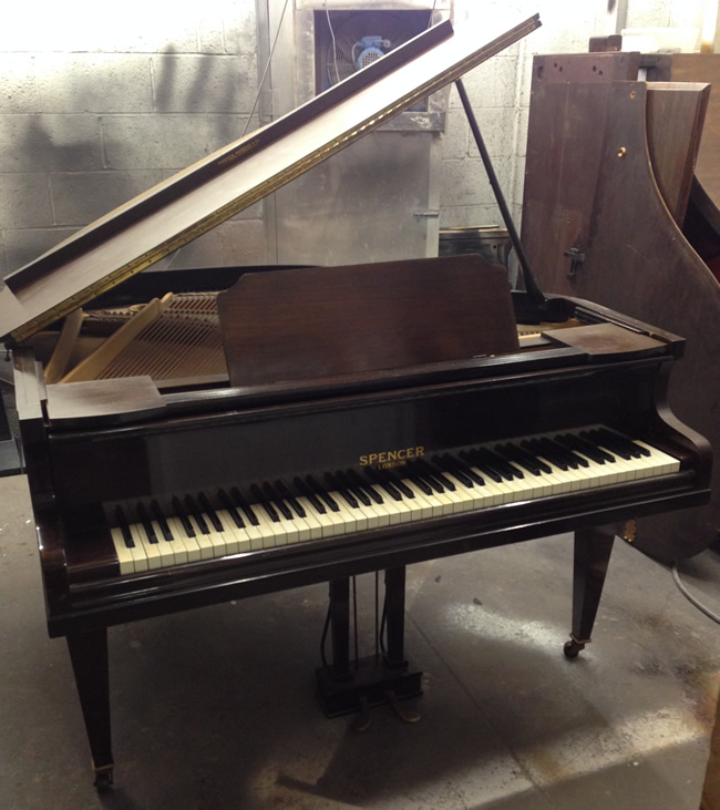 Spencer baby grand piano. 