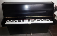 B Squire small black satin upright piano.