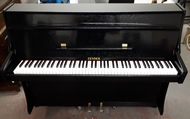 Zender Black gloss upright pianos.