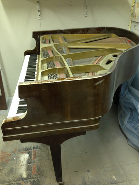 Sideview of Murdoch baby grand piano.