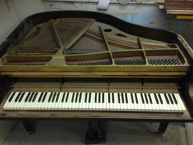 Frame, Strings and Dampers etc before restoration has taken place.