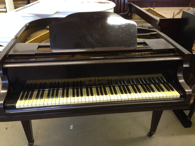 Boyd 6 1/2 octave baby grand piano.