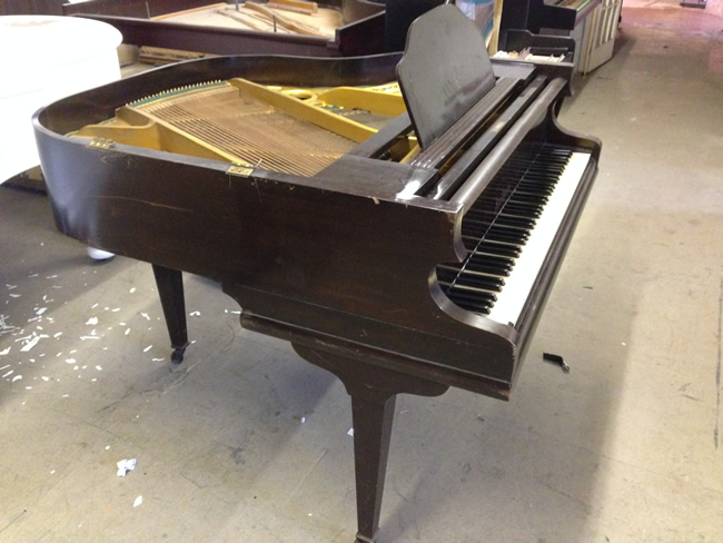 Sideview of Boyd mini grand piano.