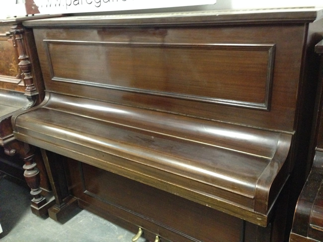 Chappel piano waiting to be restored and re-polished.