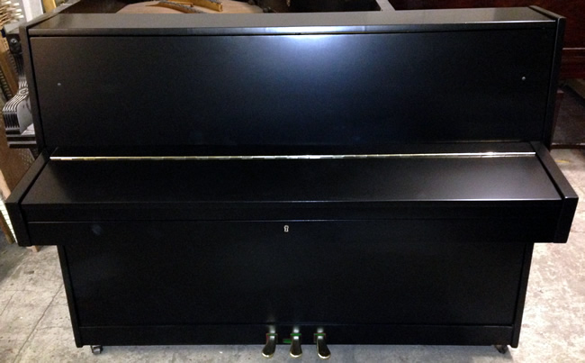 Black satin piano. 