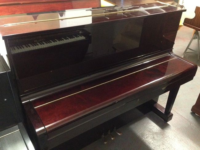 Dark Mahogany gloss piano.