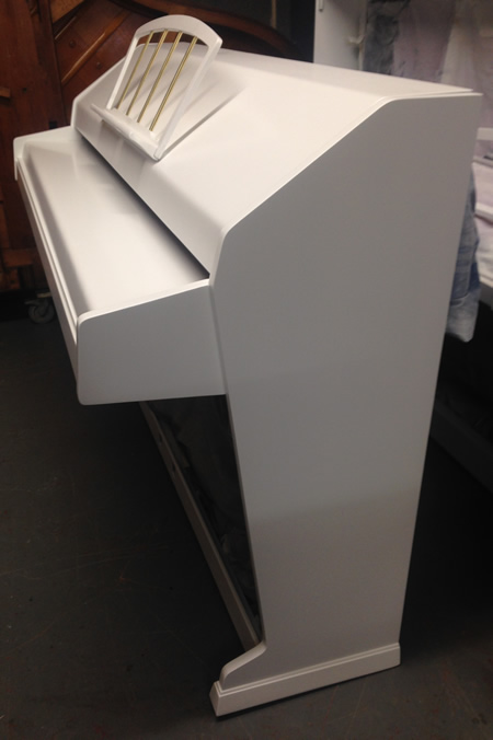 Sideview of eavestaff mini royal piano.