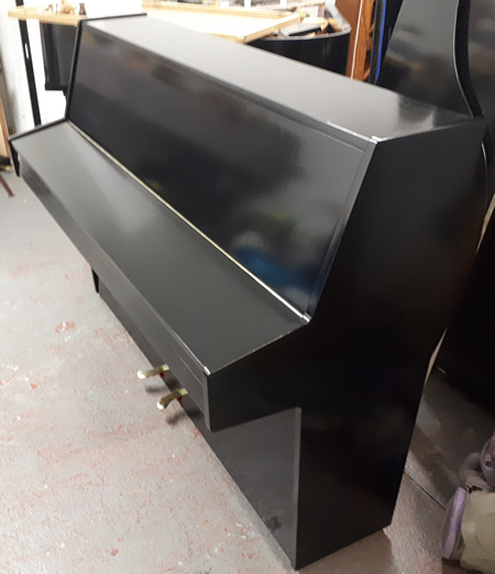 Hupfeld small modern piano.
