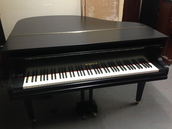 Black satin baby grand piano.