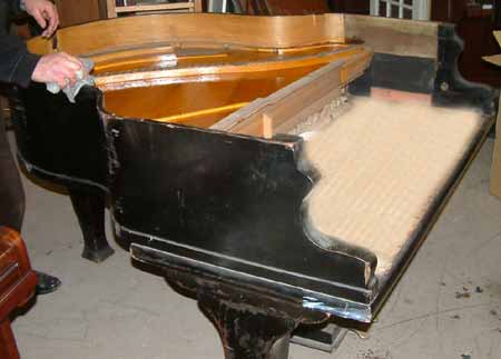 Piano before being re-polished White Satin. 