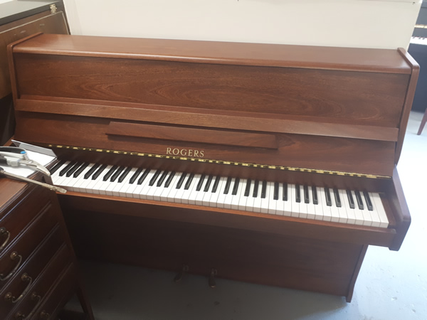 Rogers upright in a Light Mahogany cabinet