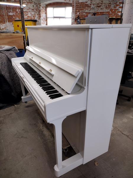 Samick white gloss piano.