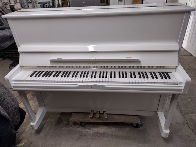 Samick upright piano in a White gloss finish.