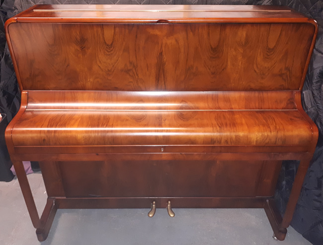 Squire Walnut satin piano.