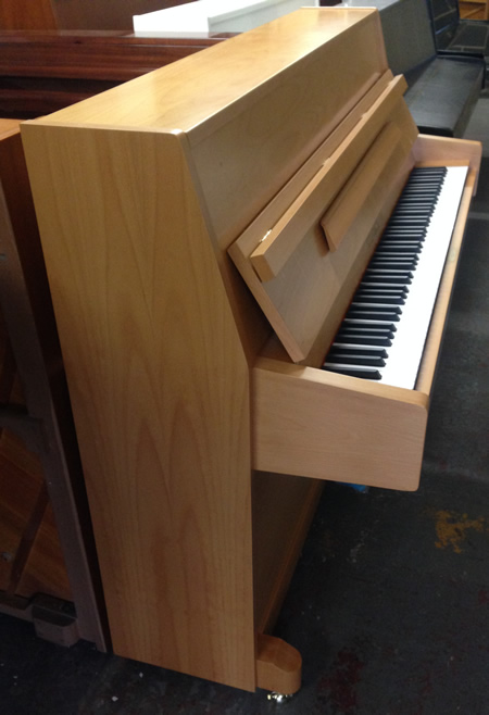 Steinbach piano in a Beech satin finish.