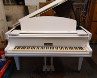 White baby grand pianos