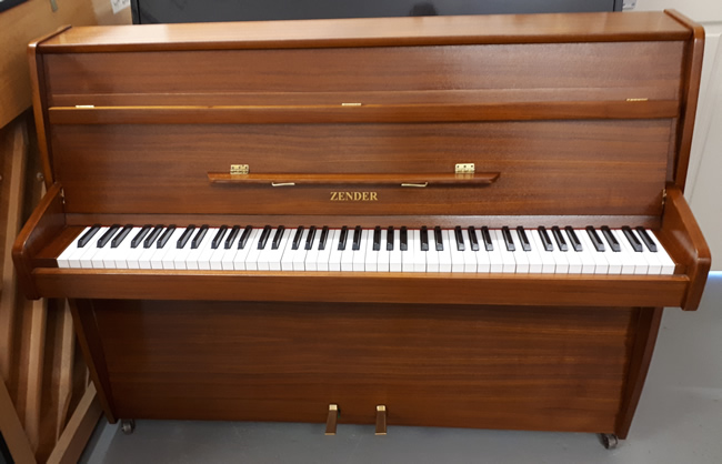 Zender small modern upright in a Teak satin cabinet.